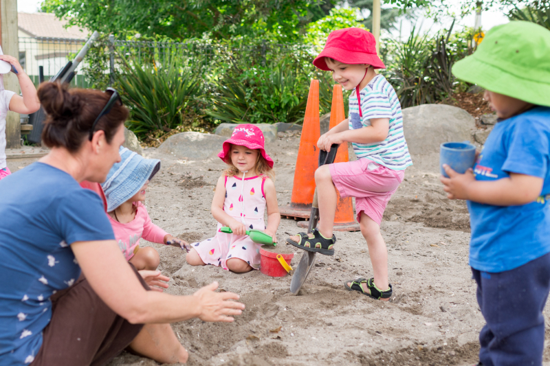 group-of-kindergarten-children-in-sandpit