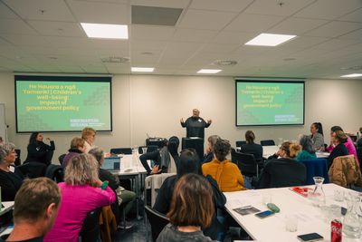 A room full of people at a KA Forum
